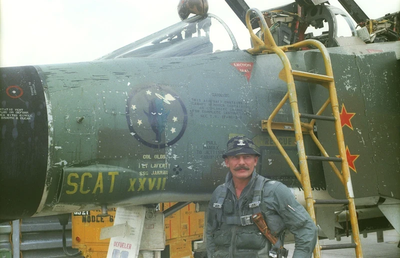 Robin Olds next to his F-4
